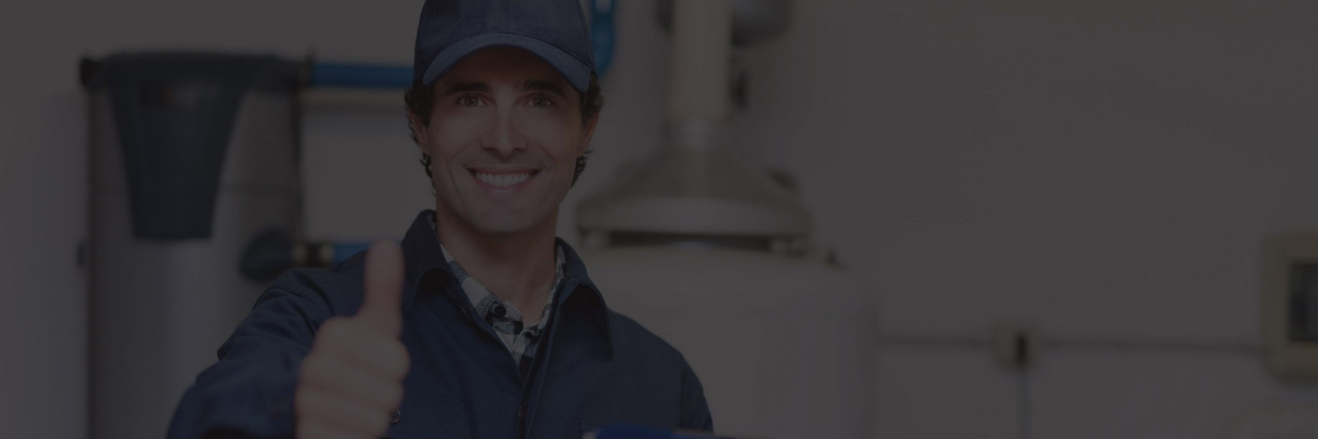 Smiling plumber at work